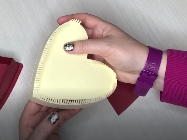glue the teeth to the inside of the heart shape
