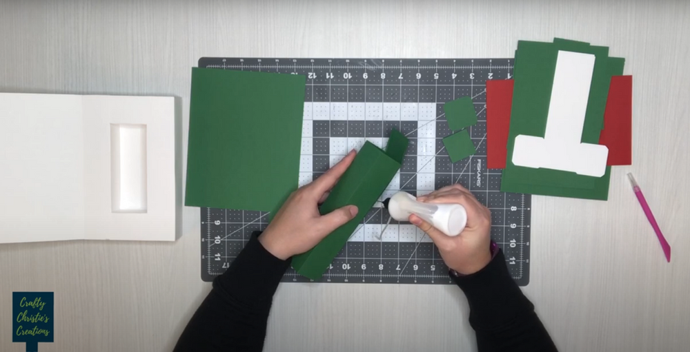 folding up the box by adding glue to the small tab